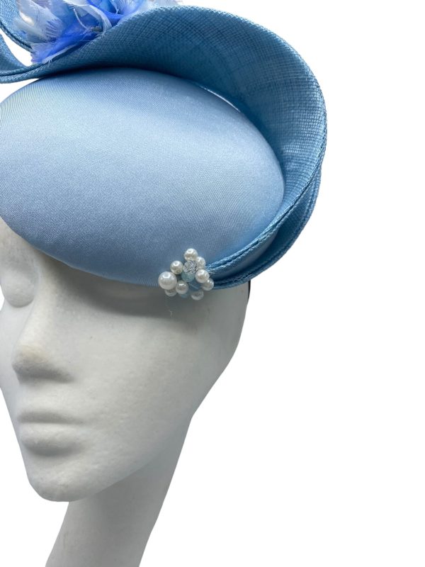 Ice blue structured headpiece.